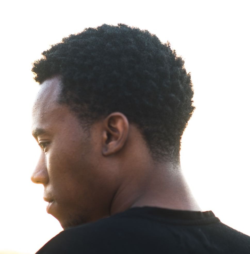 man wearing black crew-neck t-shirt