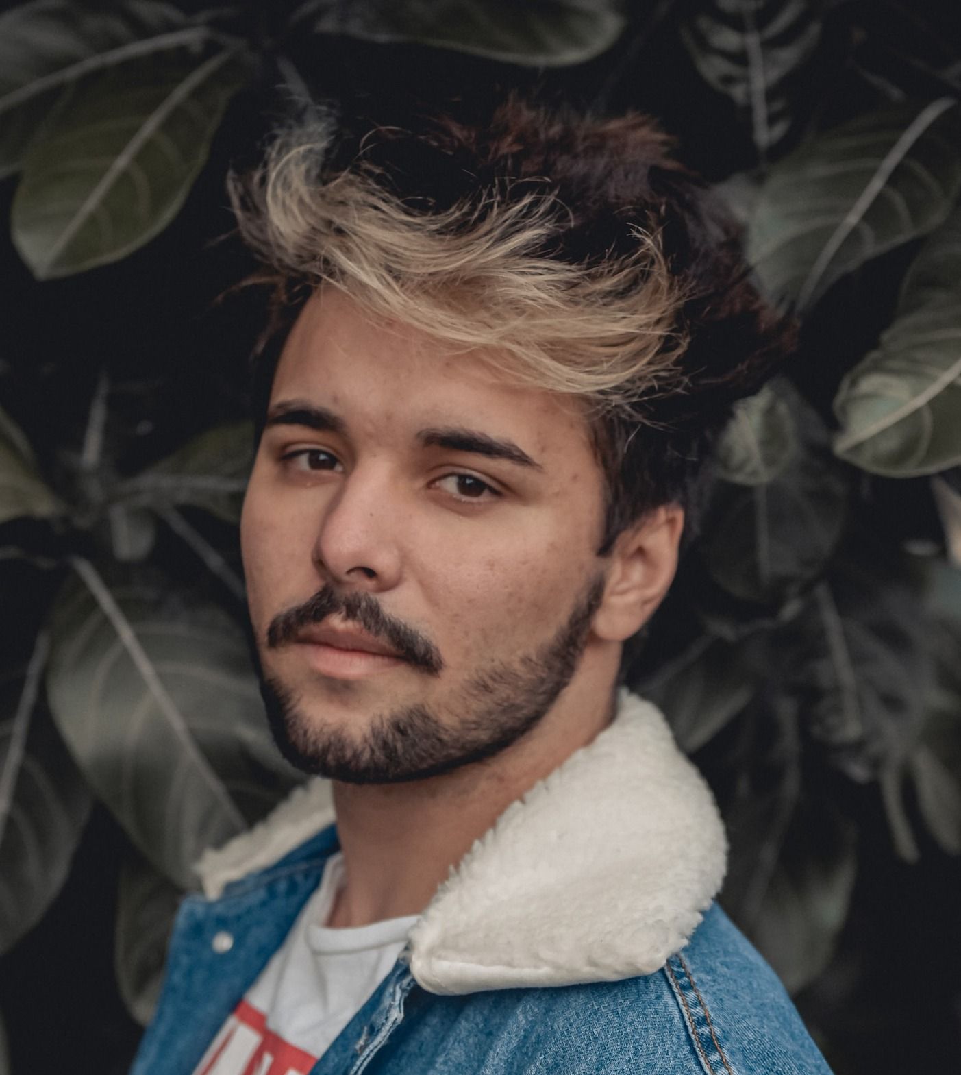 man in blue denim button up jacket