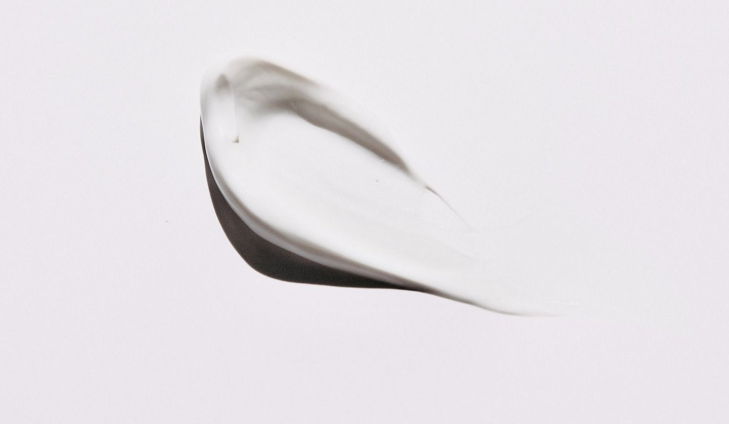 stainless steel spoon on white surface