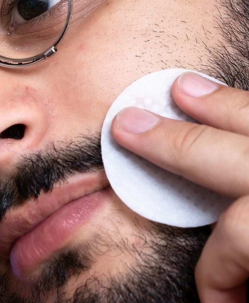 man with white round ornament on his mouth men's skincare gifts sets