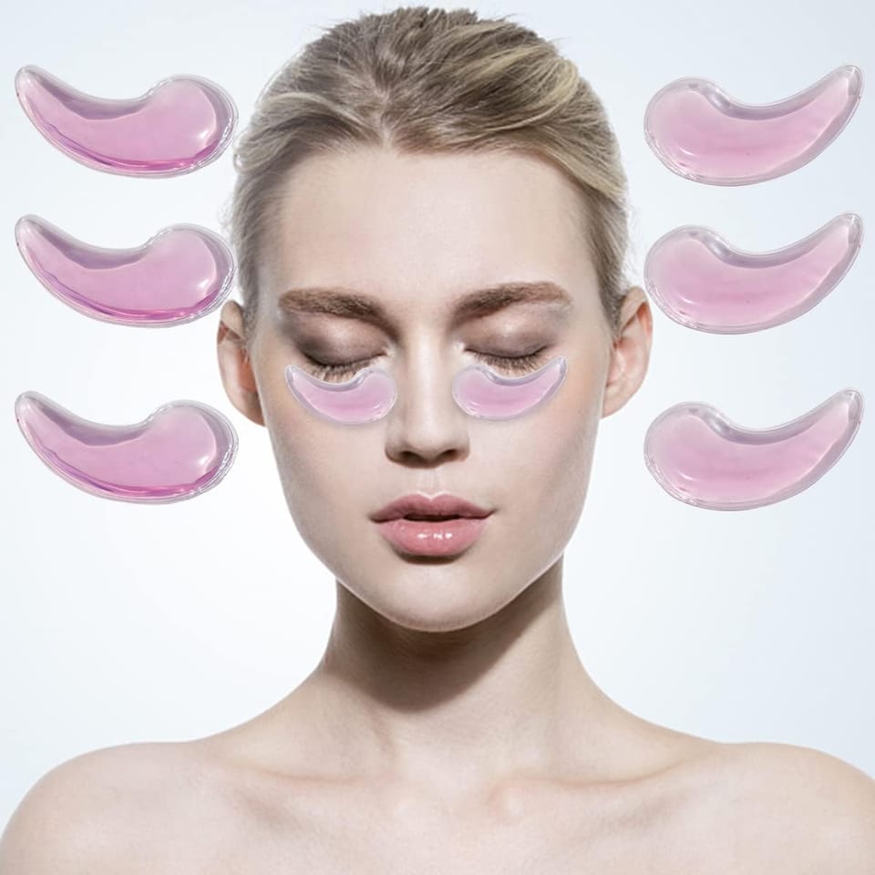 Lady with closed eyes and several pink under eye gel patches on white background