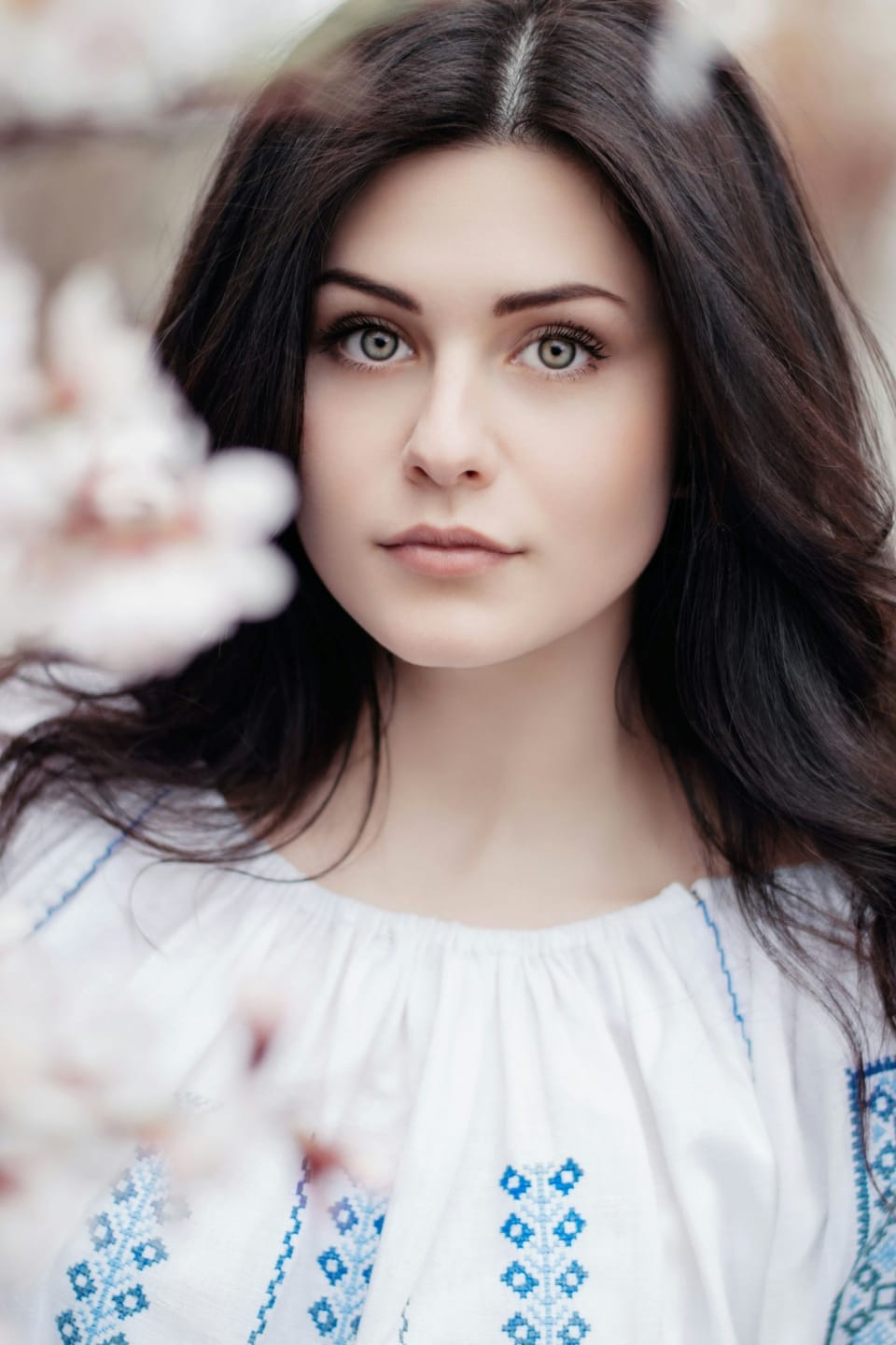 full frontal close-up photo of girl with blue and white top - Bakuchiol Serums 